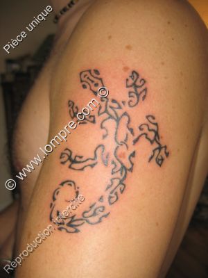 tattoo d'un lezard compose de 7 lezards